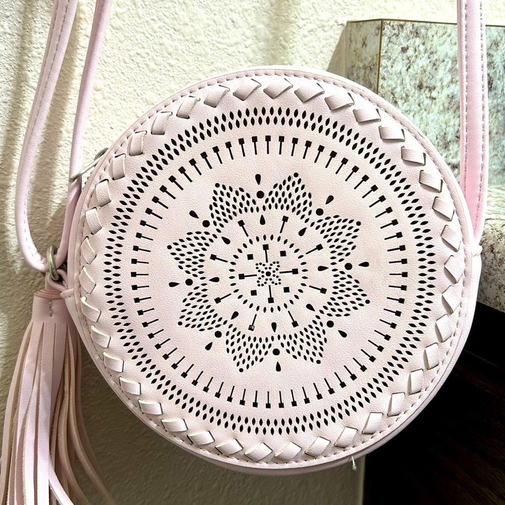 Baby pink Native American style round cross body purse.
